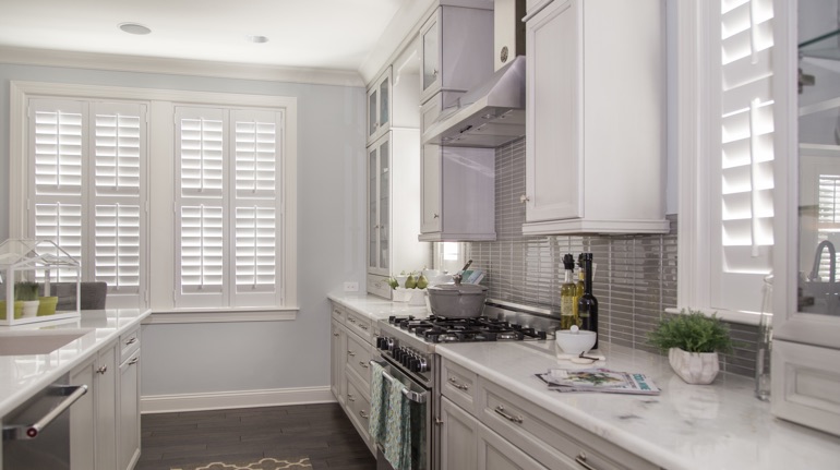 Plantation shutters in Boise kitchen with white cabinets.